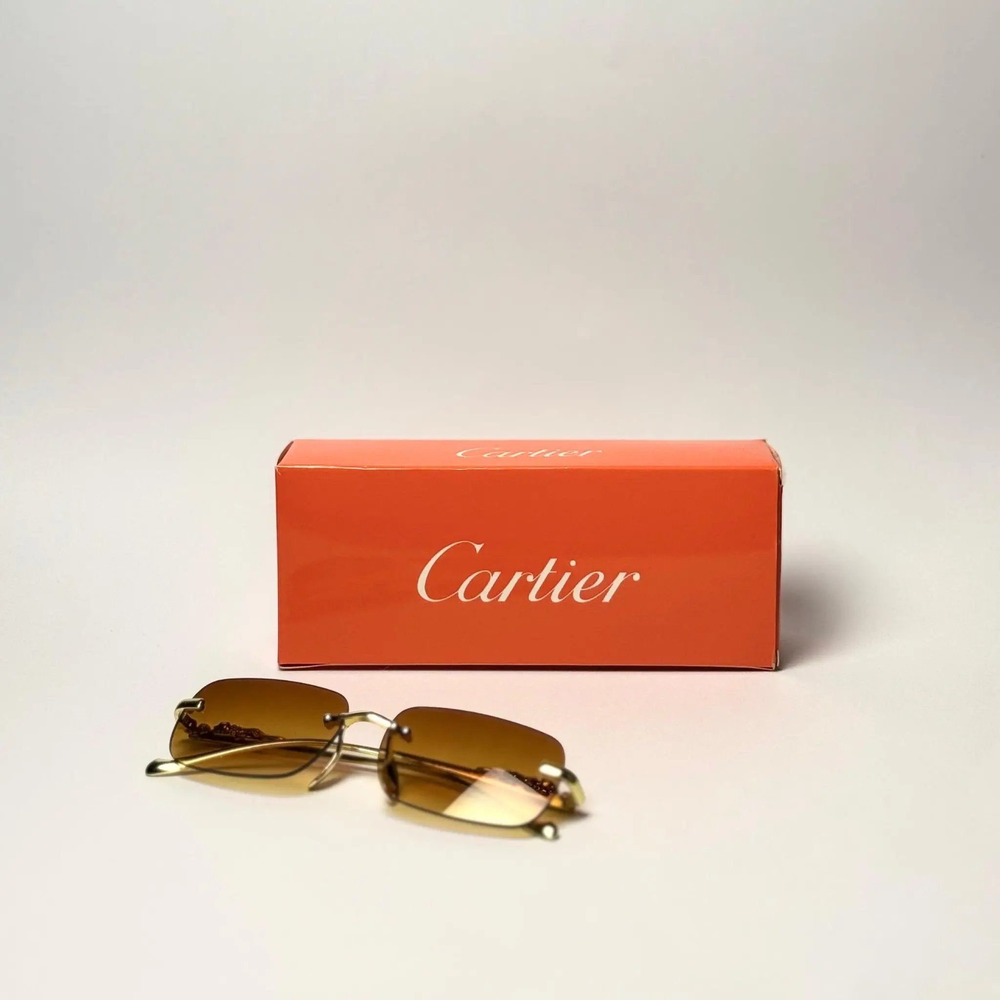 Cartier Gold Rimless Sunglasses – Brown Gradient Lens with Signature Detailing